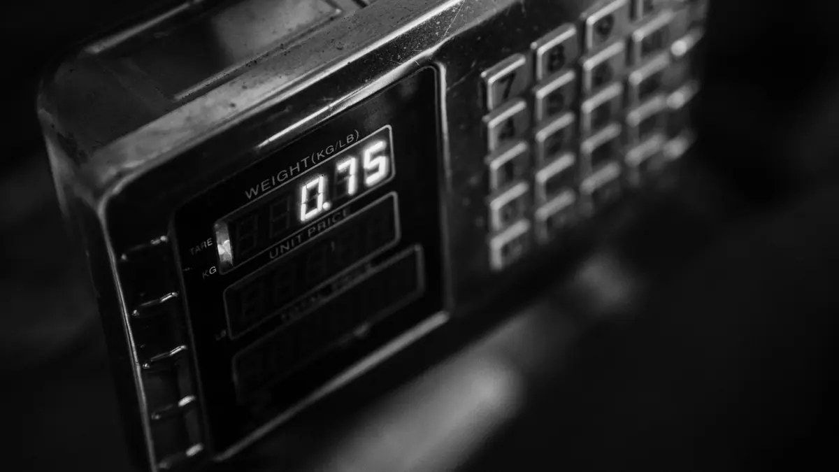 Close-up of a digital weighing scale display reading 0.75, in black and white