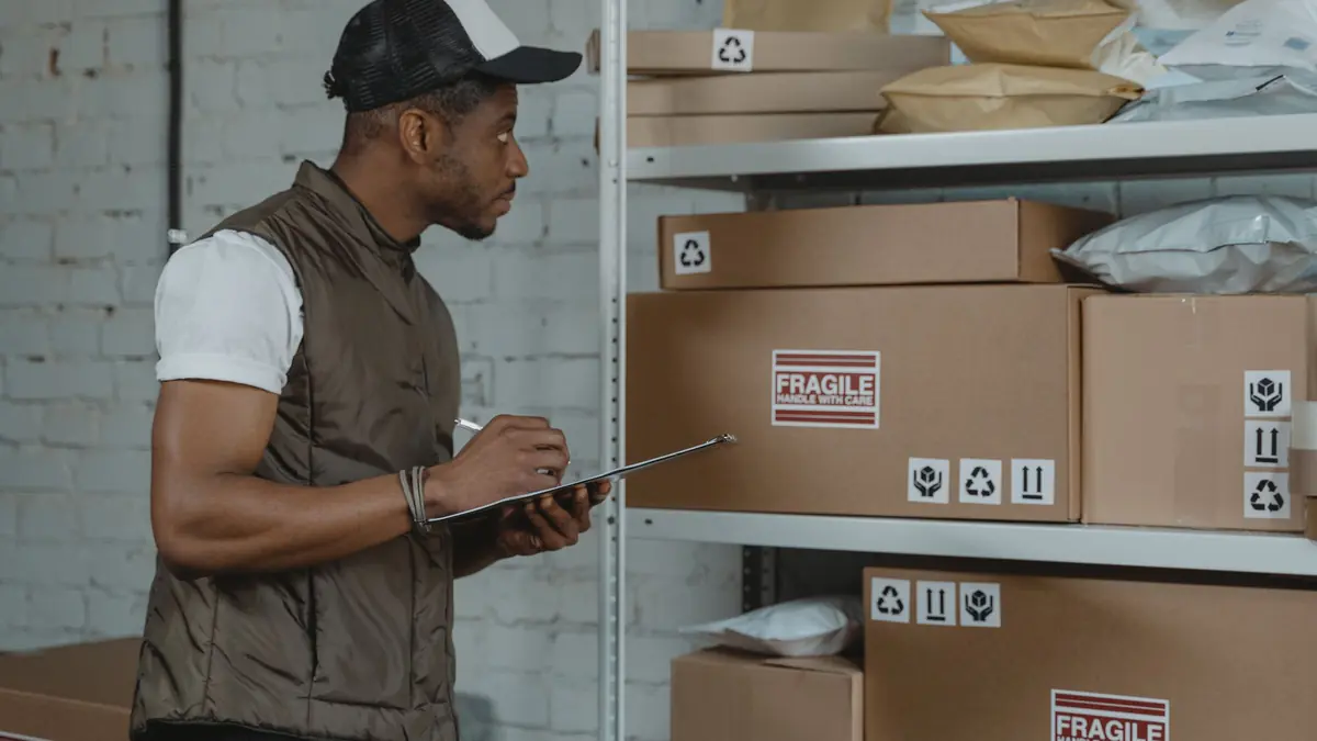 A warehouse worker with a clipboard checks shelves of cardboard parcels marked fragile