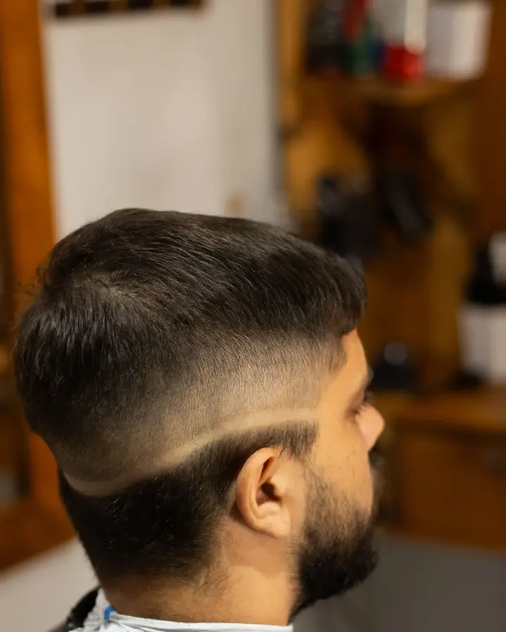 Skin fade with hard part