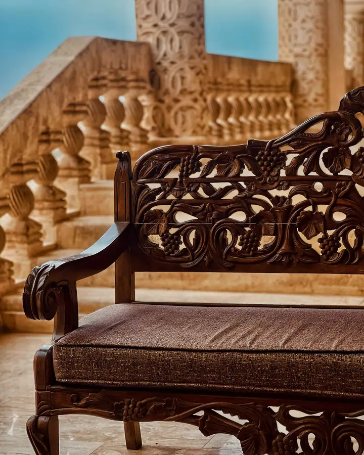 Carved teak settee
